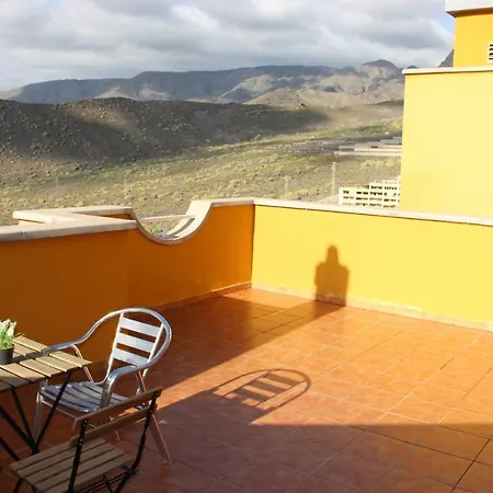 With A Serene Ocean And Mountain View Apartment
