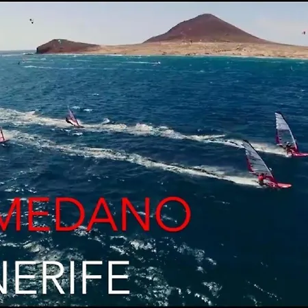 With A Serene Ocean And Mountain View